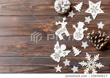 Top view of Christmas decorations and toys on wooden background. Copy space. Empty place for your design. New Year concept 108494617