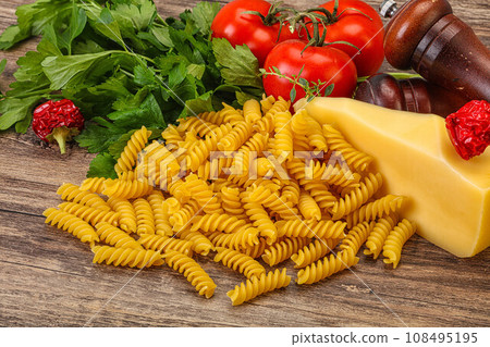 Italian pasta - raw Girandole for cooking 108495195