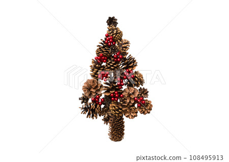Isolated Christmas tree made from natural cones on colored background, view from above. New Year minimal concept with copy space 108495913