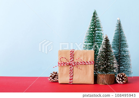 Christmas composition. Gifts, small tree, branches and craft DIY decorations on white background. New year concept. Christmas home decoration Flat lay, top view, copy space Christmas composition. Gifts, small tree, branches and craft DIY decorations on white background. New year concept. Christmas home decoration Flat lay, top view, copy space 108495943