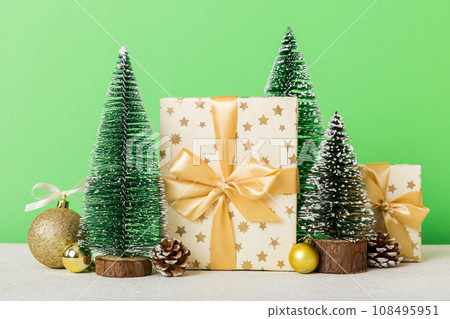 Christmas composition. craft Gift box, small tree, branches and craft DIY decorations on white background. New year concept. Christmas home decoration Flat lay, top view, copy space 108495951