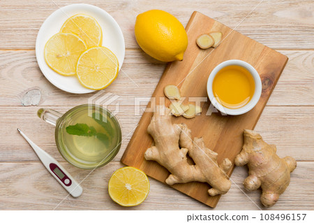 Natural cold and flu home remedies. Natural ingredients for immunity stimulation and viruses protection. top view flat lay Natural cold and flu home remedies. Natural ingredients for immunity stimulation and viruses protection. top view flat lay 108496157