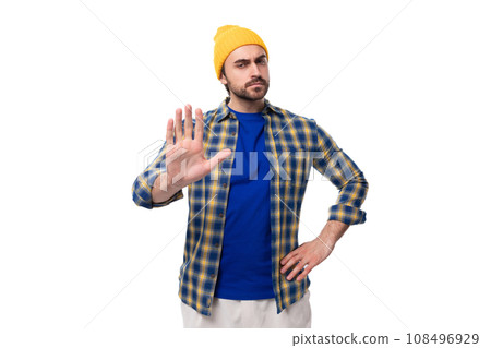 handsome young male hipster in cap and shirt thinking over white background with copy space 108496929