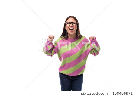 young beautiful caucasian woman with straight black hair with glasses is dressed in a stylish autumn 108496971