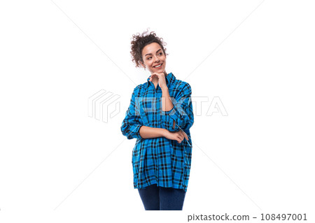 a young woman with a casual haircut dressed in a casual shirt stands with her arms crossed in front a young woman with a casual haircut dressed in a casual shirt stands with her arms crossed in front 108497001