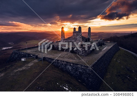 Aerial view of a stone monument, memorial on a hill during sunset. The Barrow of Milan Rastislav Stefanik in Slovakia. 108498801