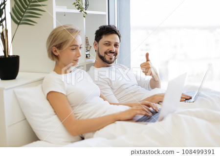 Mature people spending time at home using modern gadgets 108499391