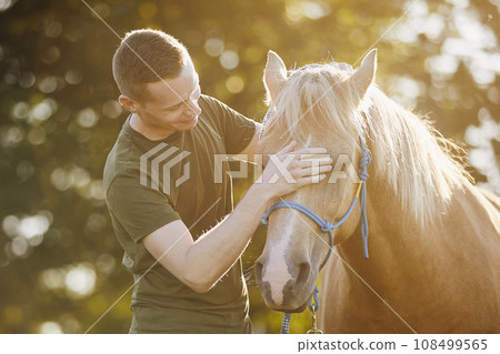 Man embracing of therapy horse. Man embracing of therapy horse. 108499565