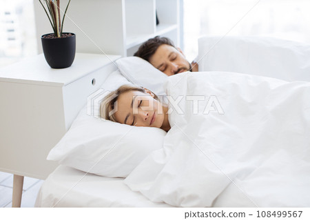 Caucasian family sleeping sweet together in bed Caucasian family sleeping sweet together in bed 108499567