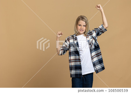 Blonde teen girl looking happy and contented Blonde teen girl looking happy and contented 108500539