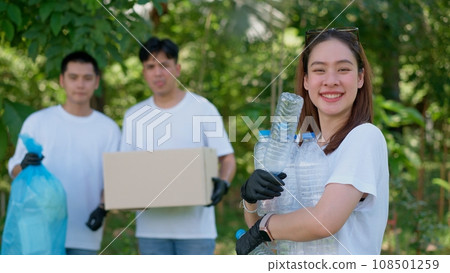 Happy young Asian students diverse volunteers with garbage bags cleaning area in the park, The concept of environmental conservation on world environment day, recycling, charity for sustainability. Happy young Asian students diverse volunteers with garbage bags cleaning area in the park, The concept of environmental conservation on world environment day, recycling, charity for sustainability. 108501259