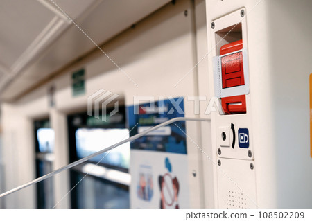 the red emergency door release switch control inside the sky train, it's set up beside the door. 108502209