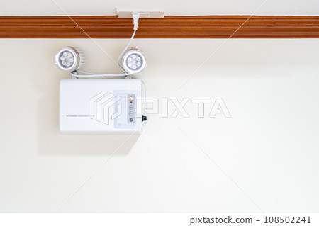 Automatic EMERGENCY LIGHT in hospital is charging and power pluging on the wall that ready to use when the power went out. Automatic EMERGENCY LIGHT in hospital is charging and power pluging on the wall that ready to use when the power went out. 108502241