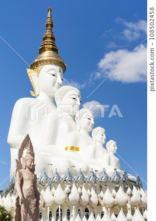 Wat Phra That Pha Kaew, Phetchabun is one of the top Thailand famous temples with a huge five white jade buddhas layered statue sitting on the big lotus, called The Sanctuary of the Five Buddhas. 108502458