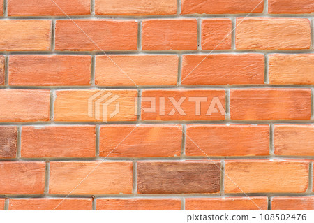 orange brown artificial Brick Foam background at outdoor field. 108502476
