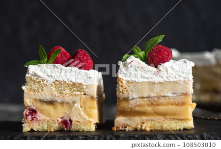 Fruit cake with bananas and raspberries 108503010