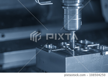 The CNC milling machine chamfer cutting mold base part by chamfer tool in the light blue scene. The CNC milling machine chamfer cutting mold base part by chamfer tool in the light blue scene. 108504250