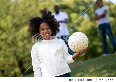 Cute happy african american family spending weekend in the park 108504566