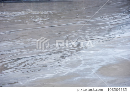 Muddy waters in a decantation pond. Toxic residuals from a copper mine decating in a settling basin 108504585