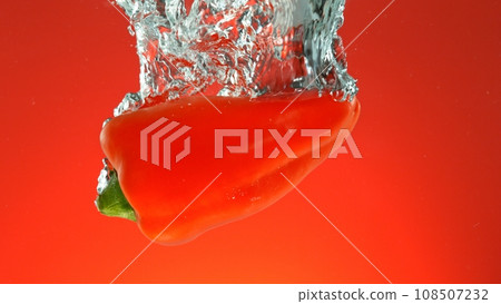 Red Pepper Falling into Water. Red Pepper Falling into Water. 108507232
