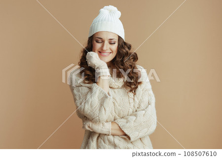 happy stylish woman isolated on beige background 108507610