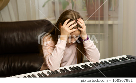 Frustrated Young Pianist at Home 108507991