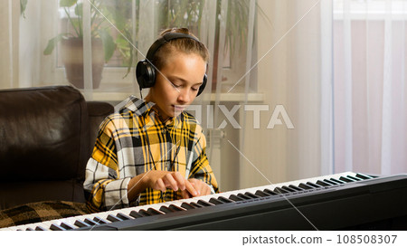 Young Pianist in Practice Young Pianist in Practice 108508307
