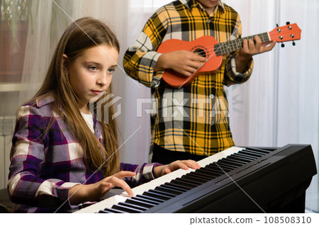 Young Musicians Practicing Together Young Musicians Practicing Together 108508310