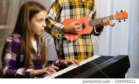 Young Musicians Practicing Together Young Musicians Practicing Together 108508311