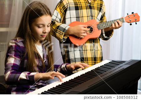 Young Musicians Practicing Together Young Musicians Practicing Together 108508312
