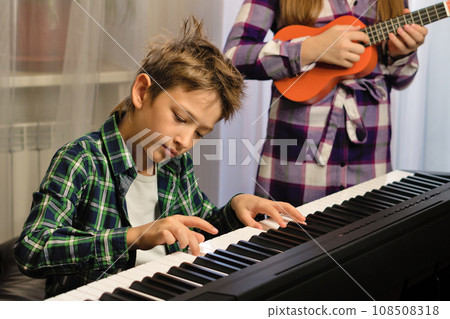 Siblings' Music Practice Session Siblings' Music Practice Session 108508318