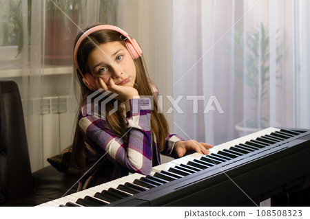 Pensive Piano Practice Moment 108508323