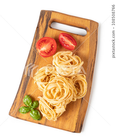 Pasta tagliatelle on a cutting board 108508766