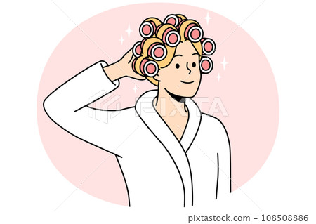 Smiling woman with curlers on head Smiling woman with curlers on head 108508886