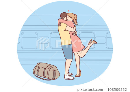 Happy couple hug meeting at railway station 108509232