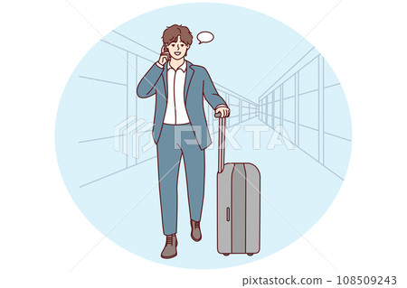 Businessman walk in airport talk on cell 108509243