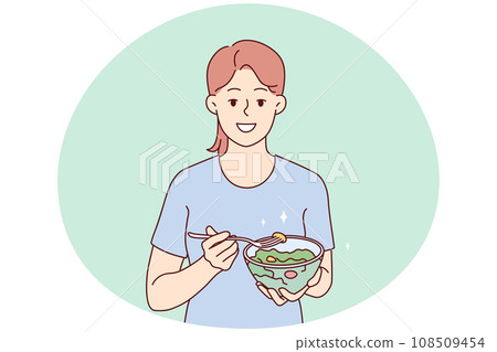 Smiling woman eating healthy vegetable salad Smiling woman eating healthy vegetable salad 108509454