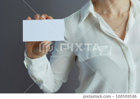 Closeup on small business owner woman isolated on gray Closeup on small business owner woman isolated on gray 108509586