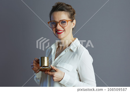happy trendy female employee against grey background 108509587