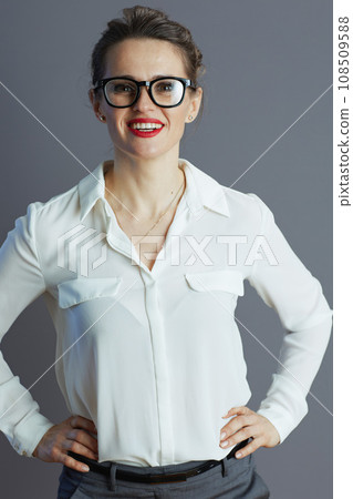 happy stylish woman worker in white blouse isolated on gray 108509588