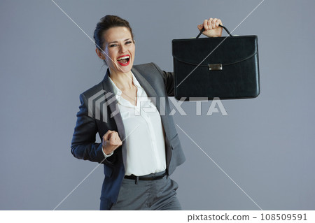smiling trendy 40 years old woman employee isolated on gray 108509591