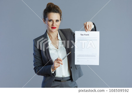 modern small business owner woman isolated on gray background modern small business owner woman isolated on gray background 108509592