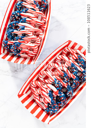 American flag. Red, white, and blue chocolate-covered pretzel twists. 108511623