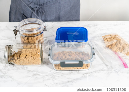 Light brown sugar on a marble counter top. 108511808