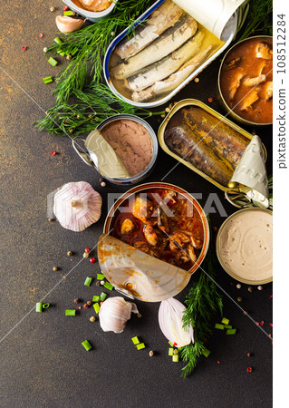 Open tin cans with canned fish Open tin cans with canned fish 108512284