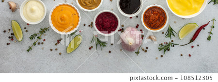 Different types of sauces in bowls 108512305