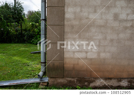 Wet building facade. Rain, wind and weather conditions Wet building facade. Rain, wind and weather conditions 108512905