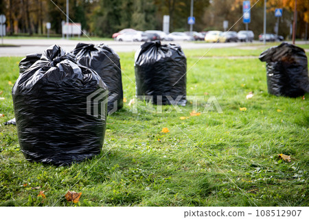 Stack of garbage bags for take out. Clean up the city park in the spring and autumn Stack of garbage bags for take out. Clean up the city park in the spring and autumn 108512907
