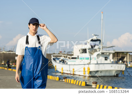 Young fishermen standing at the fishing port Young fishermen standing at the fishing port 108513264