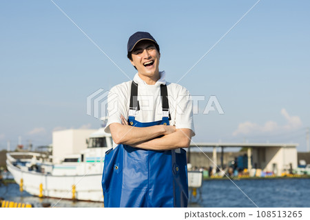 Young fishermen standing at the fishing port Young fishermen standing at the fishing port 108513265